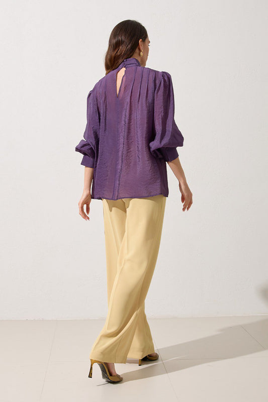 Purple shirt with ruffles